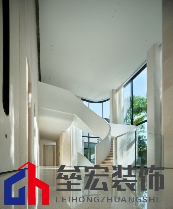 A spiral staircase in a building Description automatically generated